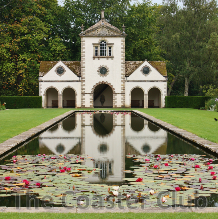 reflection of The Pin Mill in the lily pond at Bodnant Garden in Conwy